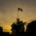 Cuban flag waving at sunset. Photo: @minint_cuba.
