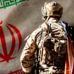 An armed soldier with a US flag on his back faces the flag of the Islamic Republic of Iran. lllustration: NEO.