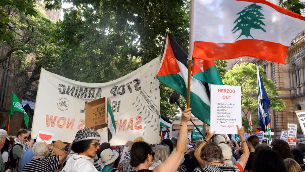 People carry flags of Palestine and Lebanon at a pro-Palestine march. File photo.