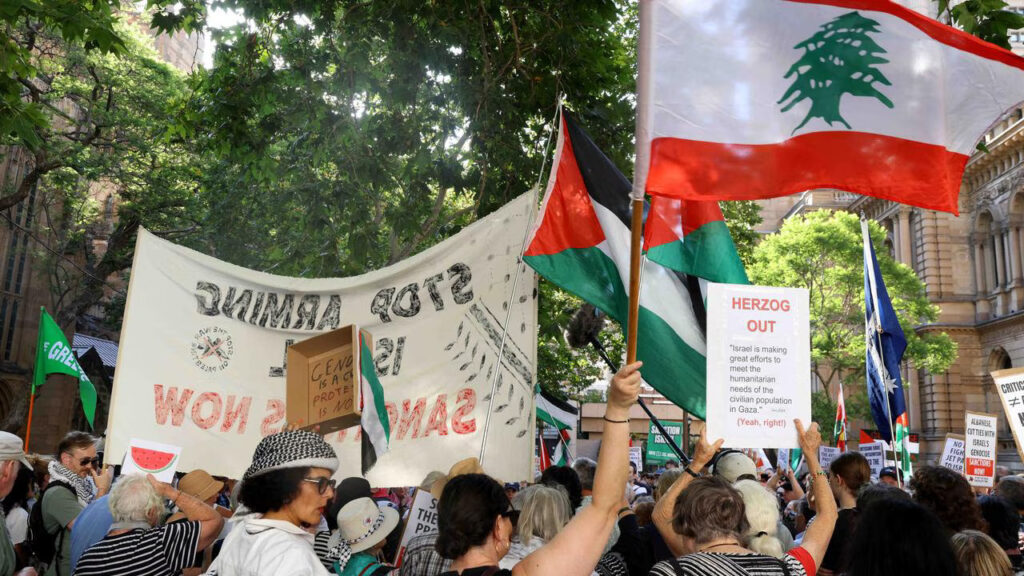 People carry flags of Palestine and Lebanon at a pro-Palestine march. File photo.