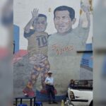 Craig Murray in front of a Chavista mural. Photo: Craig Murray.