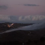 Artillery fire from an Israeli position hits the hills near the outskirts of the border town of Odaisseh in southern Lebanon. Photo: Hasan Fneich/AFP/Getty Images.
