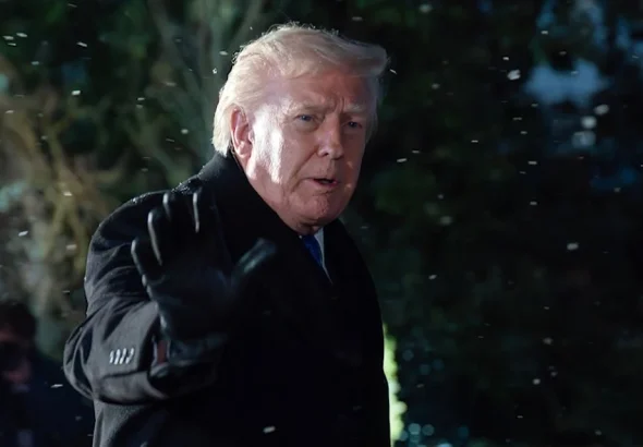 President Donald Trump speaks to reporter on the Sout Lawn before departing the White House, Friday, Feb 6, 2026, in Washington. Photo: AP.