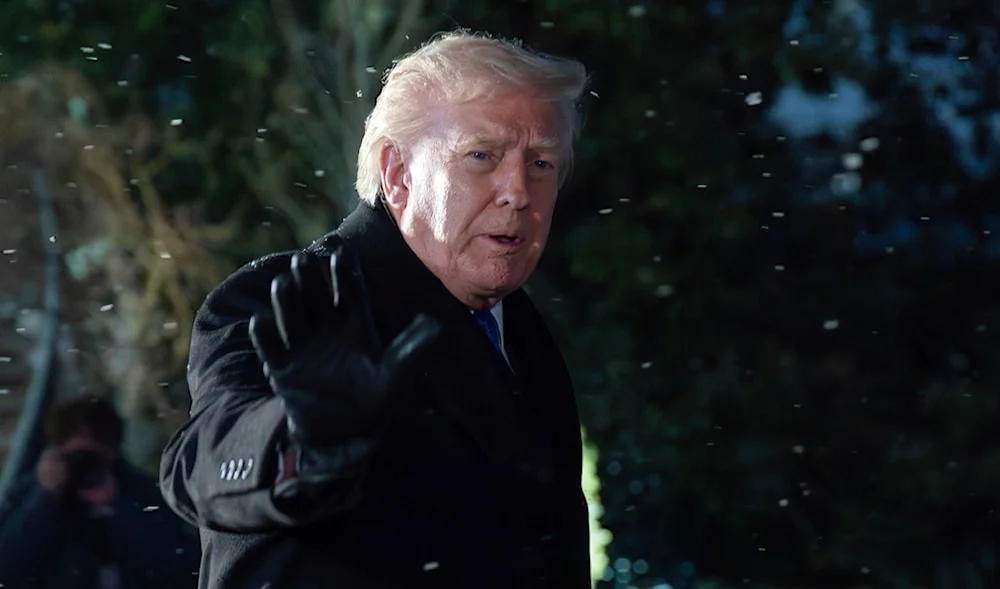 President Donald Trump speaks to reporter on the Sout Lawn before departing the White House, Friday, Feb 6, 2026, in Washington. Photo: AP.