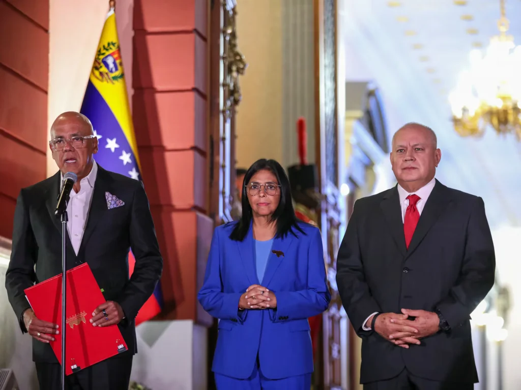 Venezuelan Acting President Delcy Rodriguez (center) next to National Assembly President Jorge Rodriguez (left) and Interior Minister Diosdado Cabello (right) in a ceremony to sign the recently approved Amnesty Law on Thursday, February 19, 2026, at Miraflores Palace. Photo: Ivan Mcgregor/Anadolu via Getty Images.
