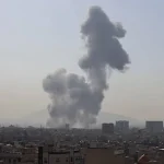 A plume of smoke rises following a reported explosion in Tehran on Saturday, February 28, 2026. Photo: AP.