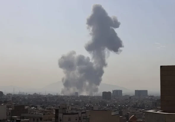 A plume of smoke rises following a reported explosion in Tehran on Saturday, February 28, 2026. Photo: AP.