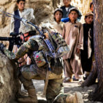 A US soldier takes position in Mush Kahel village, Ghazni province, Afghanistan, July 23, 2012. Photo: Andrew Baker.