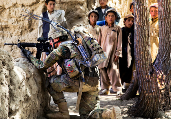 A US soldier takes position in Mush Kahel village, Ghazni province, Afghanistan, July 23, 2012. Photo: Andrew Baker.
