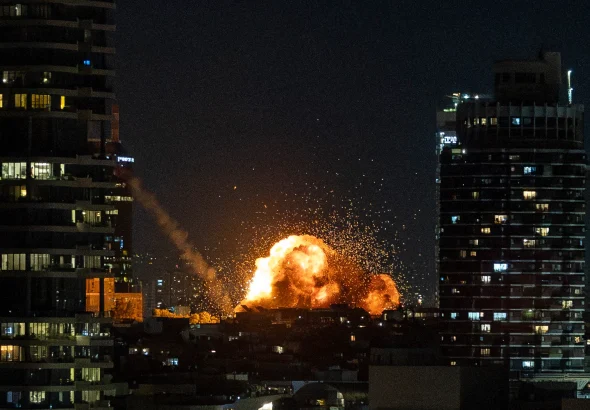 Fire and smoke rise in Tel Aviv following the impact of an Iranian missile fired in response to US-Israeli aggression, February 28, 2026. Photo: Chaim Goldberg/Flash90.