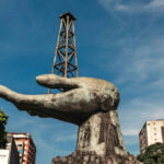 A statue of a hand holding a drilling rig near PDVSA in Caracas, Oct. 9, 2025. Photo: Adriana Loureiro Fernández/The New York Times.