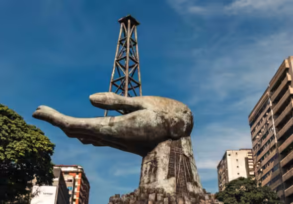 A statue of a hand holding a drilling rig near PDVSA in Caracas, Oct. 9, 2025. Photo: Adriana Loureiro Fernández/The New York Times.