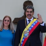 Venezuelan President Nicolas Maduro and his wife Cilia Flores wave after his swearing-in ceremony for a third term in Caracas, Venezuela, Friday, Jan. 10, 2025. Photo: Ariana Cubillos/Associated Press.