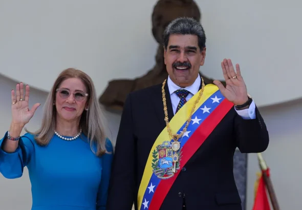 Venezuelan President Nicolas Maduro and his wife Cilia Flores wave after his swearing-in ceremony for a third term in Caracas, Venezuela, Friday, Jan. 10, 2025. Photo: Ariana Cubillos/Associated Press.