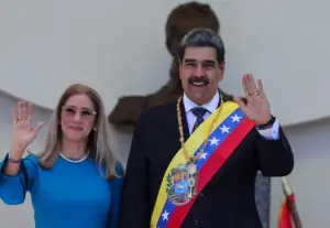 Venezuelan President Nicolas Maduro and his wife Cilia Flores wave after his swearing-in ceremony for a third term in Caracas, Venezuela, Friday, Jan. 10, 2025. Photo: Ariana Cubillos/Associated Press/file photo.
