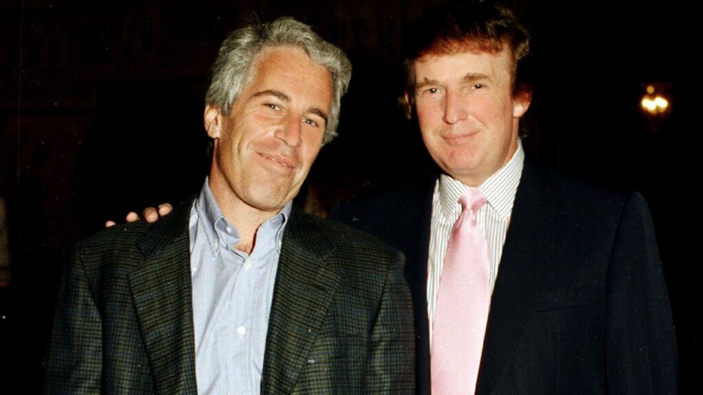 US sex trafficker Jeffrey Epstein (left) and US President Donald Trump, then a real estate developer, pose at Trump's Mar-a-Lago estate, Palm Beach, Florida, on February 22, 1997. Photo: Davidoff Studios/Getty Images.