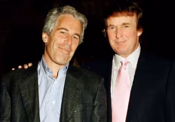 US sex trafficker Jeffrey Epstein (left) and US President Donald Trump, then a real estate developer, pose at Trump's Mar-a-Lago estate, Palm Beach, Florida, on February 22, 1997. Photo: Davidoff Studios/Getty Images.