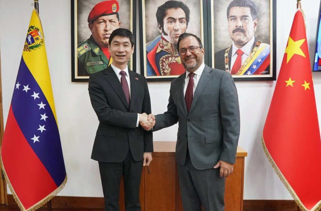 Venezuelan Foreign Minister Yván Gil shakes hands with Chinese Ambassador Han Lu at their official meeting in the Venezuelan Foreign Ministry headquarters, February 27, 2026.