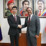 Venezuelan Foreign Minister Yván Gil shakes hands with Chinese Ambassador Han Lu at their official meeting in the Venezuelan Foreign Ministry headquarters, February 27, 2026.