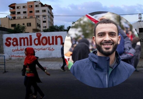 Photo composition: in the foreground Mohammed Khatib and in the background the wall painted with graffiti that says Samidoun. Photo: Samidoun Network.