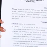 Venezuela's Acting President Delcy Rodriguez holds the text of the just-signed Amnesty Law at Miraflores Palace on Thursday, February 20, 2026. Photo: Reuters.