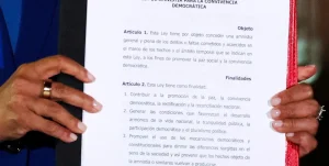 Venezuela's Acting President Delcy Rodriguez holds the text of the just-signed Amnesty Law at Miraflores Palace on Thursday, February 20, 2026. Photo: Reuters.