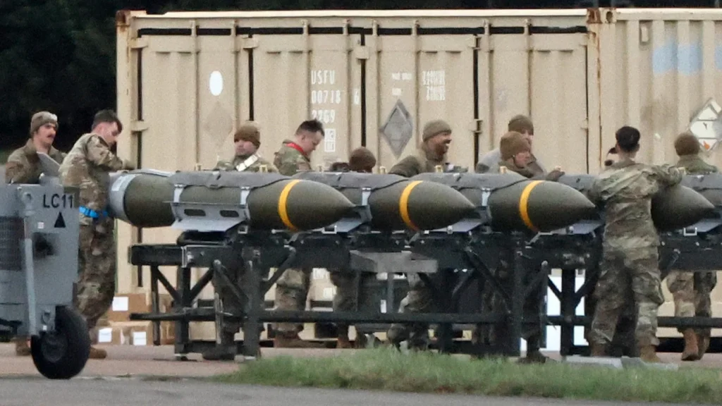 US Air Force personnel load munitions onto bombers at RAF Fairford in southwest England ahead of strikes on Iran, on 10 March 2026. Photo: Henry Nicholls/AFP.