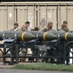 US Air Force personnel load munitions onto bombers at RAF Fairford in southwest England ahead of strikes on Iran, on 10 March 2026. Photo: Henry Nicholls/AFP.