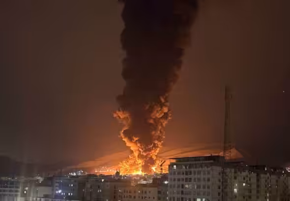 Smoke rises following an Israeli attack on the Sharan Oil depot in Tehran, Iran, on March 8, 2026. Photo: social media/PressTV.