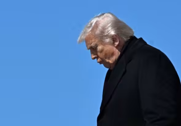 US President Donald Trump steps off Air Force One upon arrival at Dover Air Force Base in Dover, Delaware, on March 18, 2026. Photo: AFP.