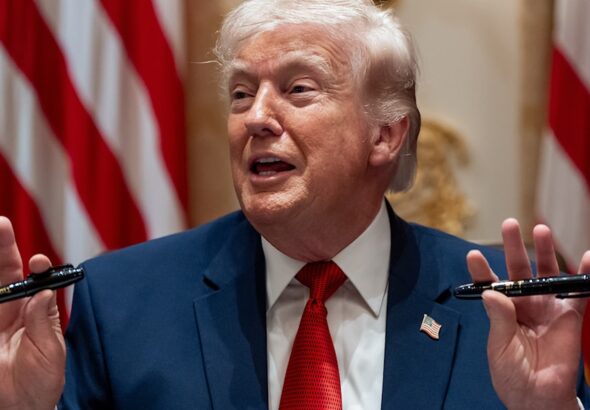 President Donald Trump holds up two Sharpie pens as he speaks during a Cabinet meeting at the White House, March 26, 23036, in Washington. Photo: AP.