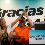 Lilian Tintori, wife of far-right opposition politician Leopoldo Lopez, joins reelected opposition lawmaker Enrique Marquez at a news conference in Caracas, Venezuela in 2015. Photo: EFE/file photo.