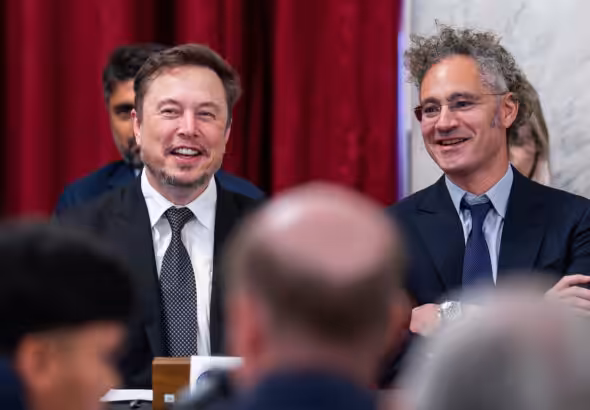 Elon Musk, CEO of X, the company formerly known as Twitter (left), and Alex Karp, CEO of the software firm Palantir Technologies. Photo: J. Scott Applewhite/AP photo