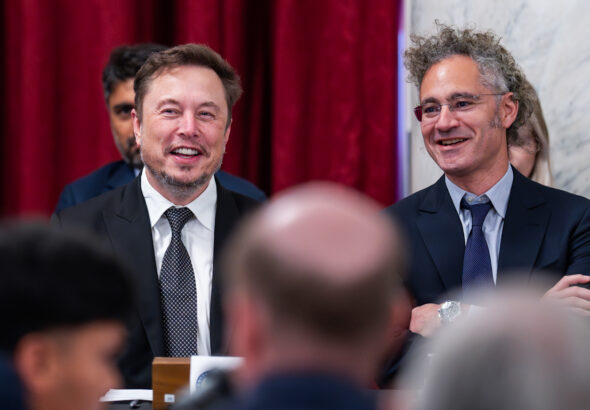 Elon Musk, CEO of X, the company formerly known as Twitter (left), and Alex Karp, CEO of the software firm Palantir Technologies. Photo: J. Scott Applewhite/AP photo