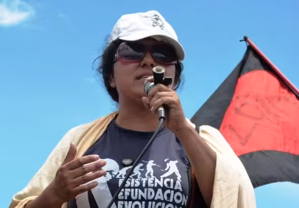 Berta Cáceres speaking outside the Soto Cano US Air Base in Honduras in 2011. Photo: Roger Harris/file photo.