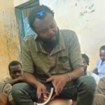 Kenyan communist leader Booker Omole educating inmates in a prison cell. Photo: X/@BookerBiro.