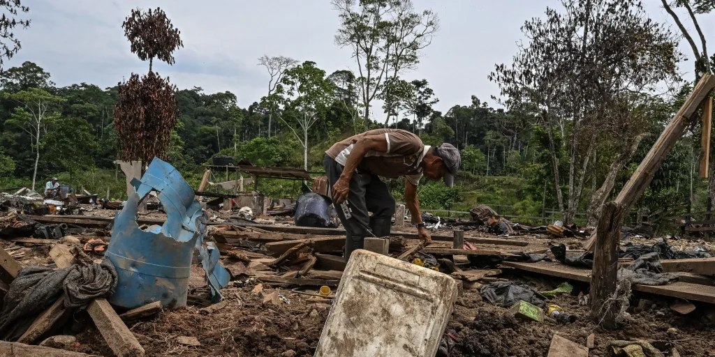 Farmer Jose Pena looks for belongings amid rubble after a bomb dropped by the Ecuadorian army in the Lago Agrio region, Sucumbios province, Ecuador, on the border with Colombia, on March 18, 2026. Photo: Luis Acosta/AFP/Getty Images.