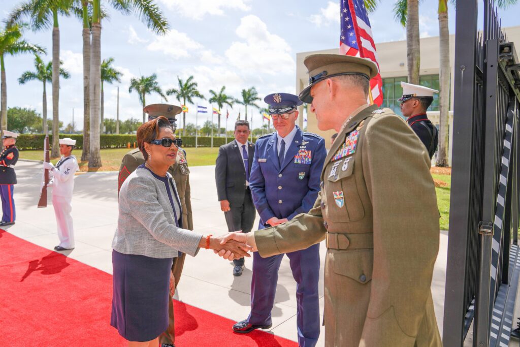 Trinidadian Prime Minister Kamla Persad-Bissessar shakes hands with SOUTHCOM Chief Francis Donovan in Miami on Monday, March 9, 2026. Photo: X/@Southcom.