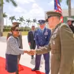 Trinidadian Prime Minister Kamla Persad-Bissessar shakes hands with SOUTHCOM Chief Francis Donovan in Miami on Monday, March 9, 2026. Photo: X/@Southcom.