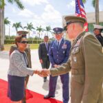 Trinidadian Prime Minister Kamla Persad-Bissessar shakes hands with SOUTHCOM Chief Francis Donovan in Miami on Monday, March 9, 2026. Photo: X/@Southcom.