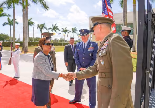 Trinidadian Prime Minister Kamla Persad-Bissessar shakes hands with SOUTHCOM Chief Francis Donovan in Miami on Monday, March 9, 2026. Photo: X/@Southcom.