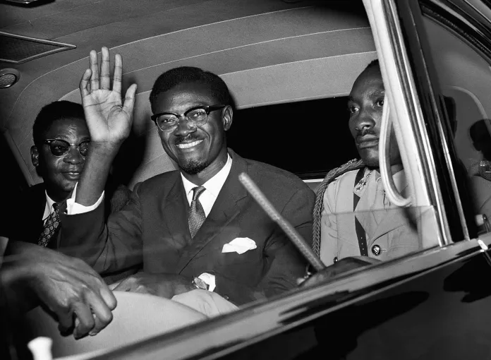 Patrice Lumumba smiles and waves from a car. Photo: RT/File photo.