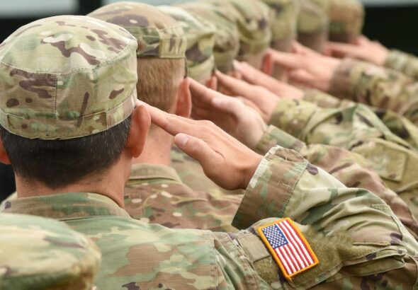 US soldiers giving salute. Photo: Shutterstock.