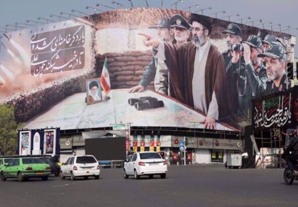 Cars pass a banner featuring Iran's new Supreme Leader Mojtaba Khamenei, amid the US-Israeli conflict with Iran, in Tehran, Iran, March 14, 2026. Majid Asgaripour/WANA.