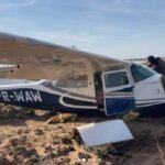 FANB officials inspect the drug jet shot down. Photo: Ministry of the Interior, Justice and Peace.