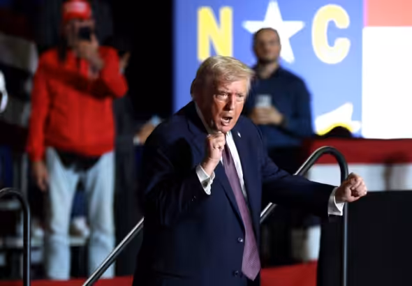 US Regime Dictator Donald Trump dances on stage during a rally at the Rocky Mount Event Center in Rocky Mount, North Carolina on December 19, 2025. Photo: Tasos Katopodis/Getty Images.