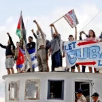 Activists of the Nuestra America Convoy aboard a ship. Photo: EFE.