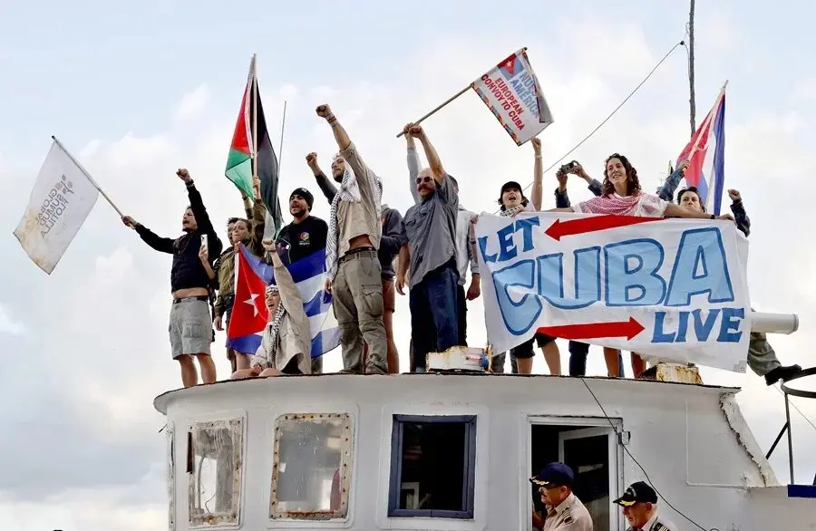 Activists of the Nuestra America Convoy aboard a ship. Photo: EFE.