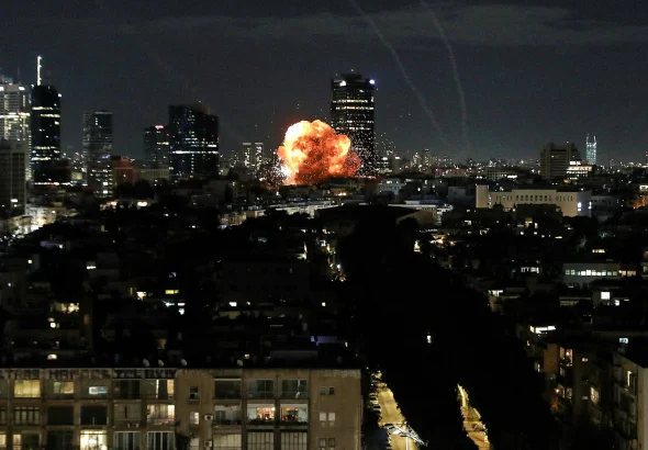 An explosion caused by a Iranian missile launched into "Israel" following "Israel" and US unprovoked strikes against Iran, in Tel Aviv, February 28, 2026. Photo: Gideon Markowicz/Reuters.
