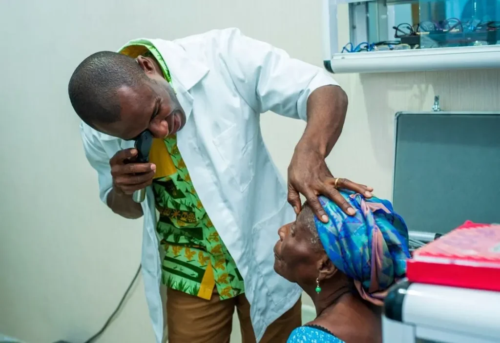 A healthcare professional conducting an eye examination for a patient. Photo: Government of Jamaica.